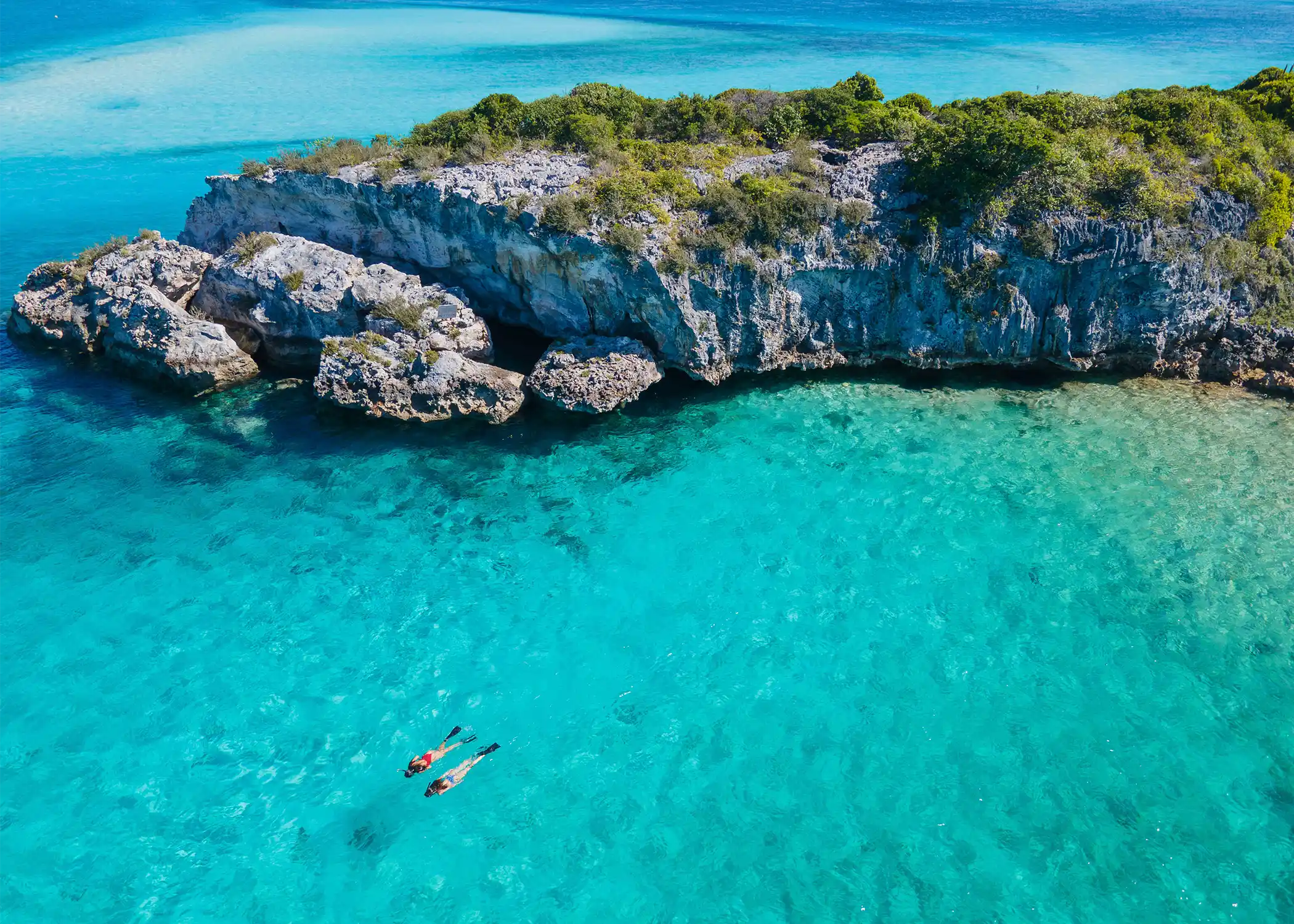 Two snorkelers in the Exuma Islands. 